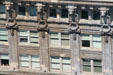 Row of lions along top floor of Hoge Building. Seattle, WA.