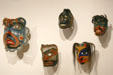 Collection of Northwest Coast native wooden human face masks at Seattle Art Museum. Seattle, WA.