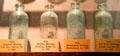 Collection of turn-of-the-century WV-made glass bottles at West Virginia State Museum. Charleston, WV.