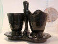 Black pressed glass creamer & sugar on stand by Paden City Glass Co., Paden City, WV at Huntington Museum of Art. Huntington, WV.