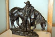 Evening sculpture of cowboy with horse by Solon H. Borglum at Buffalo Bill Center of the West. Cody, WY.