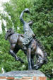 Sculpture of Cowboy on bucking bronco by Bud Boller in Jackson town park. Jackson, WY.