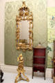 Chinoiserie pier glass over Chinese figure torchère at Lady Lever Art Gallery. Liverpool, England.