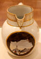 Pearlware jug with gold trim and view of Mumbles lighthouse near Swansea, decorated by Thomas Pardoe for Cambrian Pottery at National Museum of Wales. Cardiff, Wales.