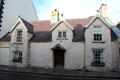 Black Lion Inn on Castle St with jackdaws - traditional name for people born within Conwy's walls - on the gables. Conwy, Wales.