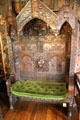 Confessional chair where mask with open mouth & ears was used for communication between priest & penitent, said to be from church in Spanish Place, London at Plas Newydd. Llangollen, Wales