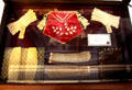 Ladies' accessories - sometimes their own handiwork - of earlier eras: Lace cuffs & gloves; silk purse; & pink red purse with beaded design with flower in the center at Plas Newydd. Llangollen, Wales.