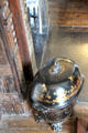 Coal scuttle next to fireplace at Plas Newydd. Llangollen, Wales.
