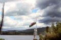 View from Portmeirion Village with Welsh flag in foreground. Gwynedd, Wales.