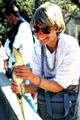 Holding a baby croc at crocodile farm in Victoria Falls. Zimbabwe.